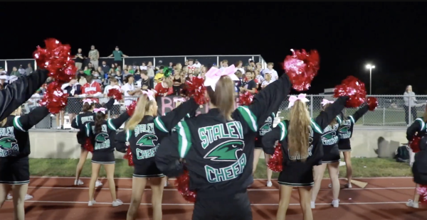 Varsity cheerleaders in front of away crowd at Lee's Summit West High School Oct. 11. Final score: 28-48